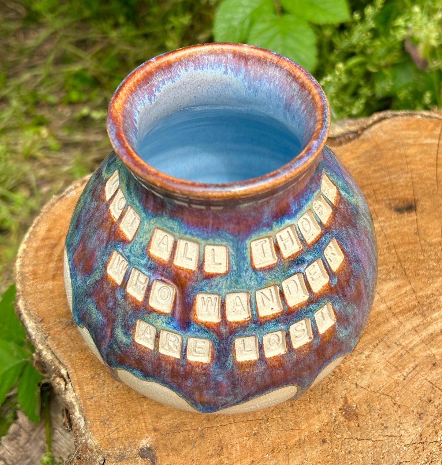 'Not all those who wander are lost' plump vase in 'heathery moors' glazes