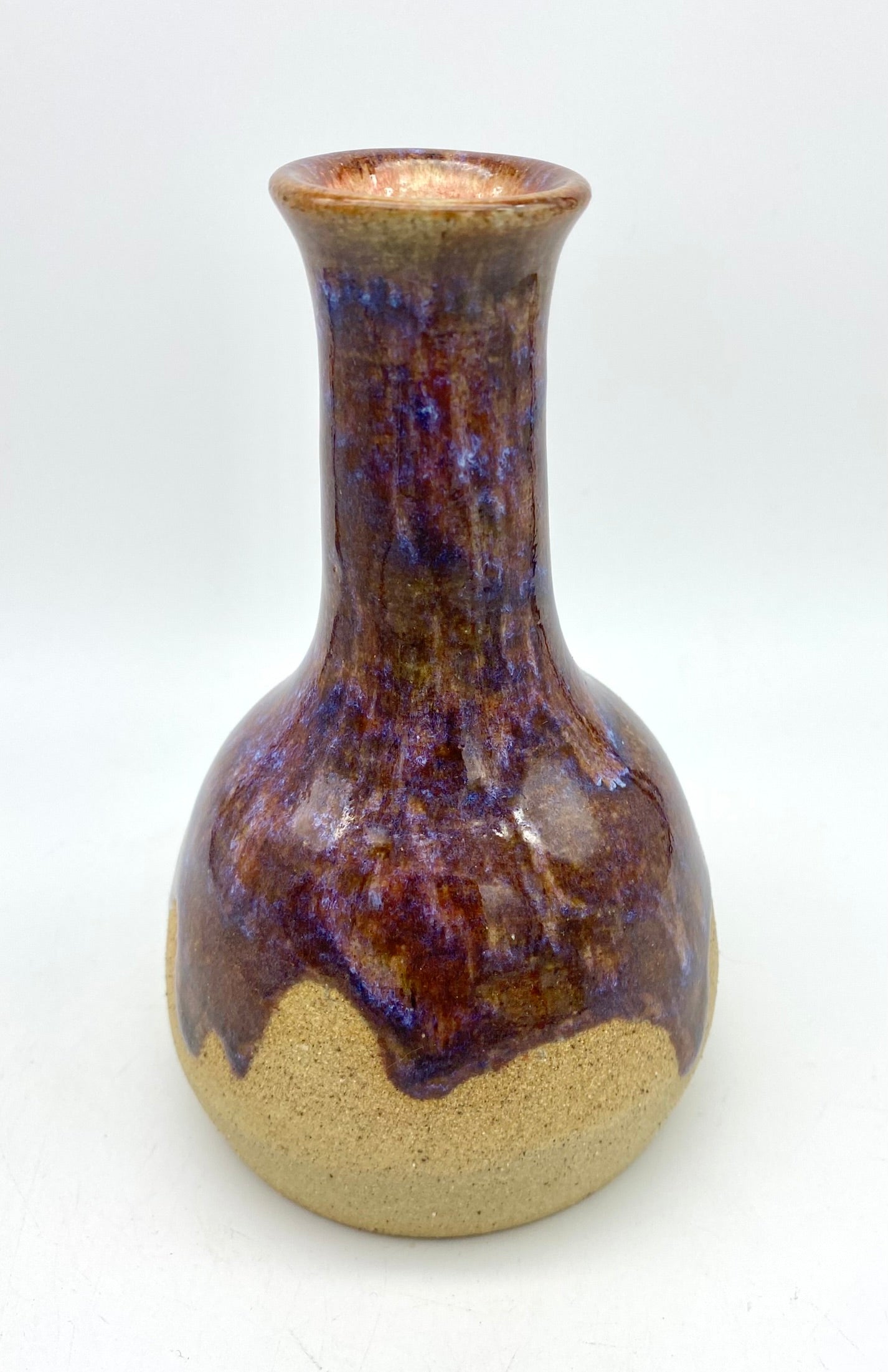 Bud vase in toasty clay with purple glazes