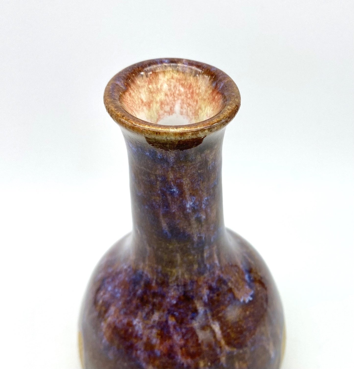 Bud vase in toasty clay with purple glazes