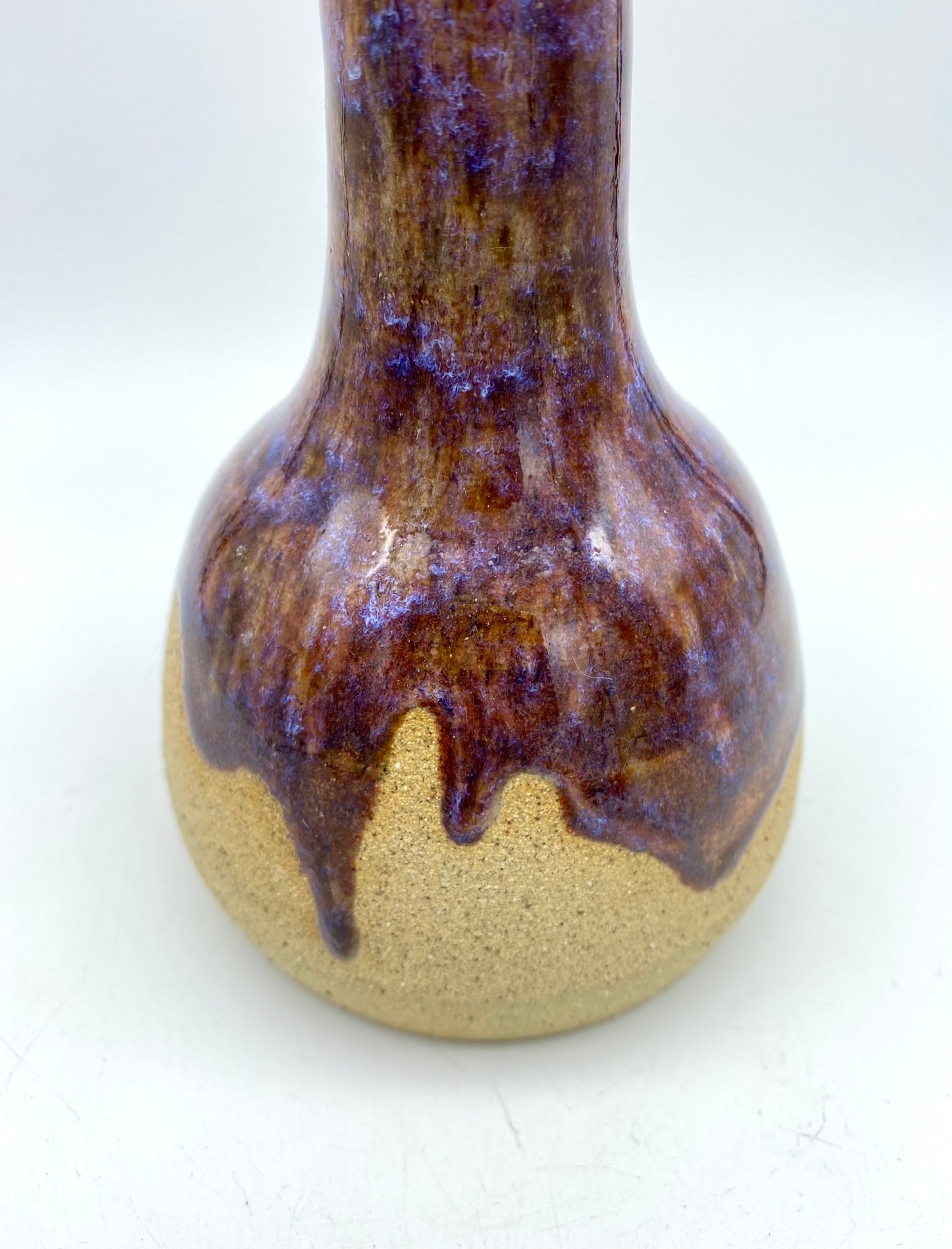 Bud vase in toasty clay with purple glazes