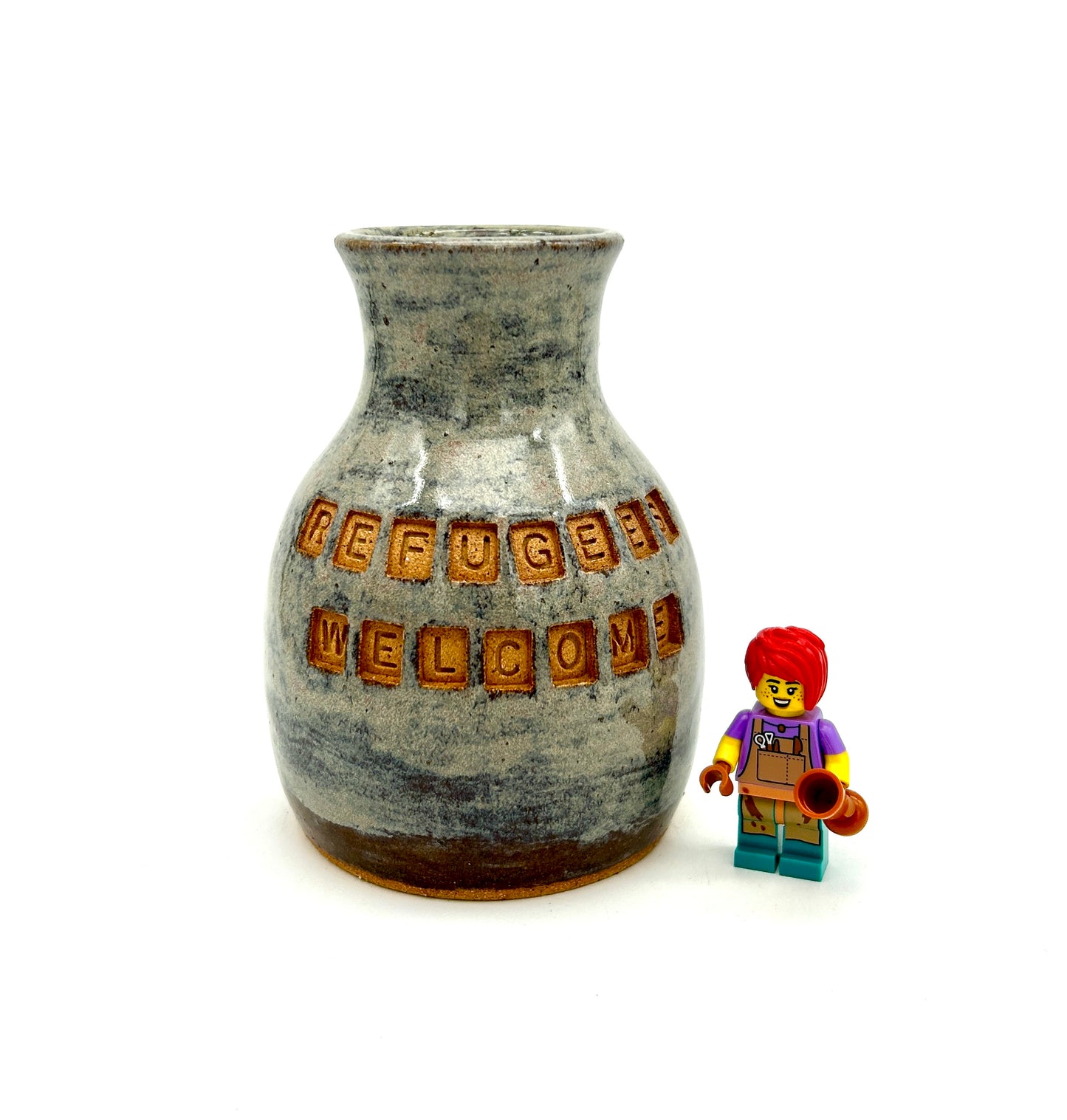 'Refugees welcome' vase in toasty clay