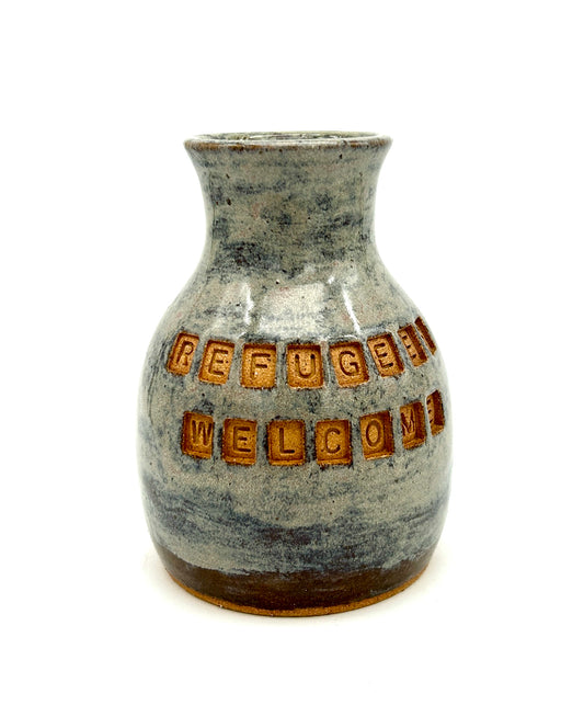 'Refugees welcome' vase in toasty clay