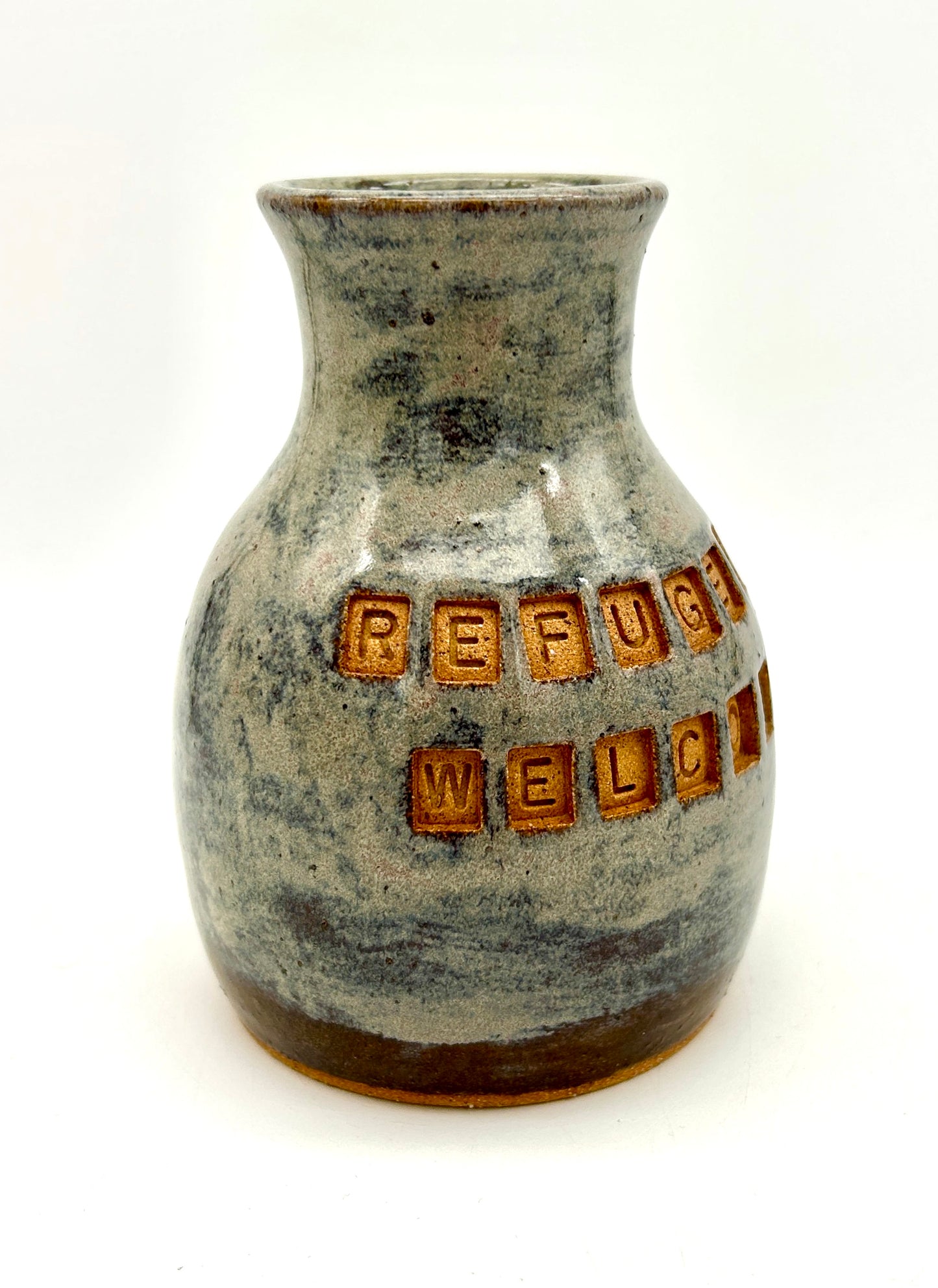 'Refugees welcome' vase in toasty clay