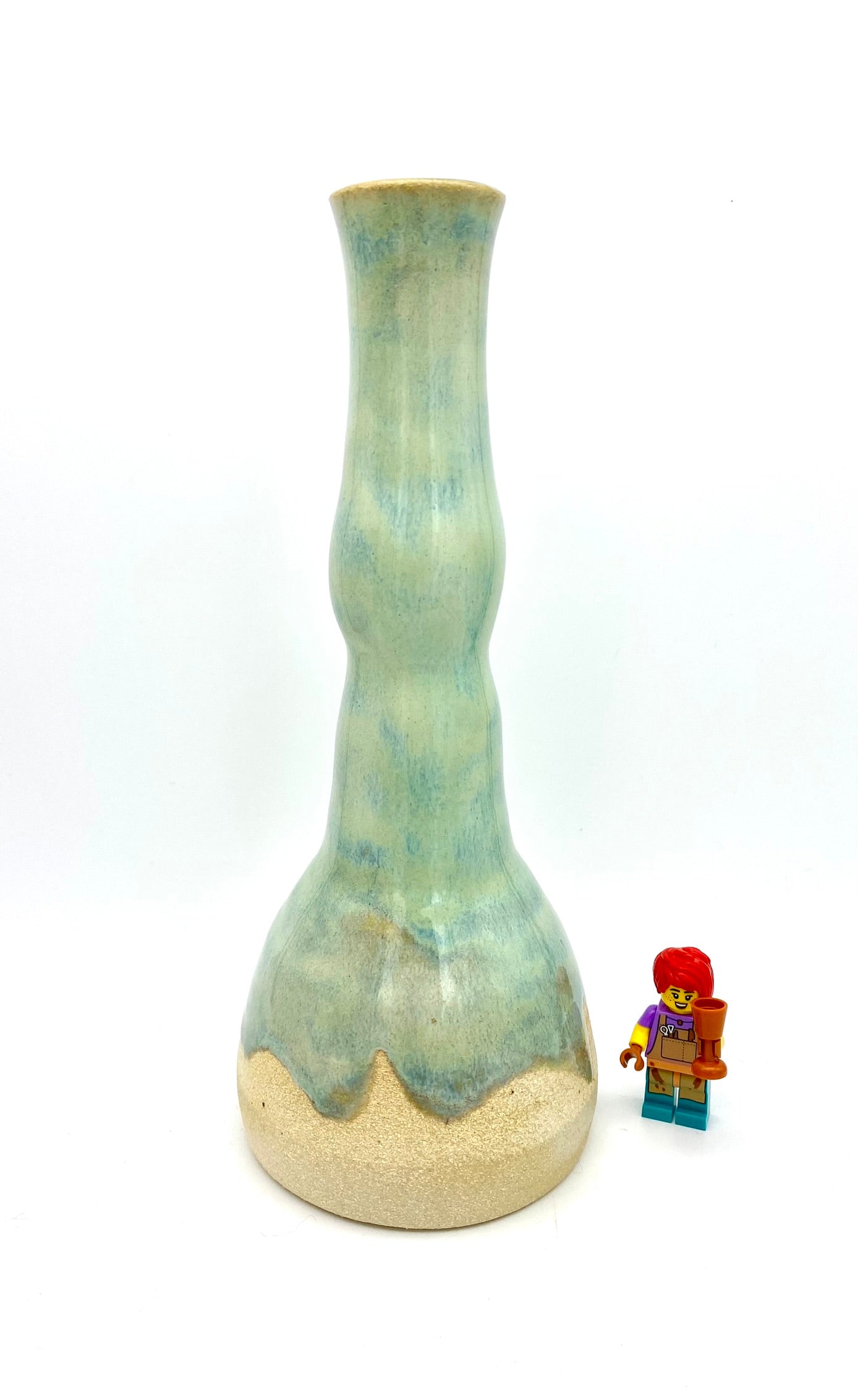 Tall candlestick or vase in flowing greens