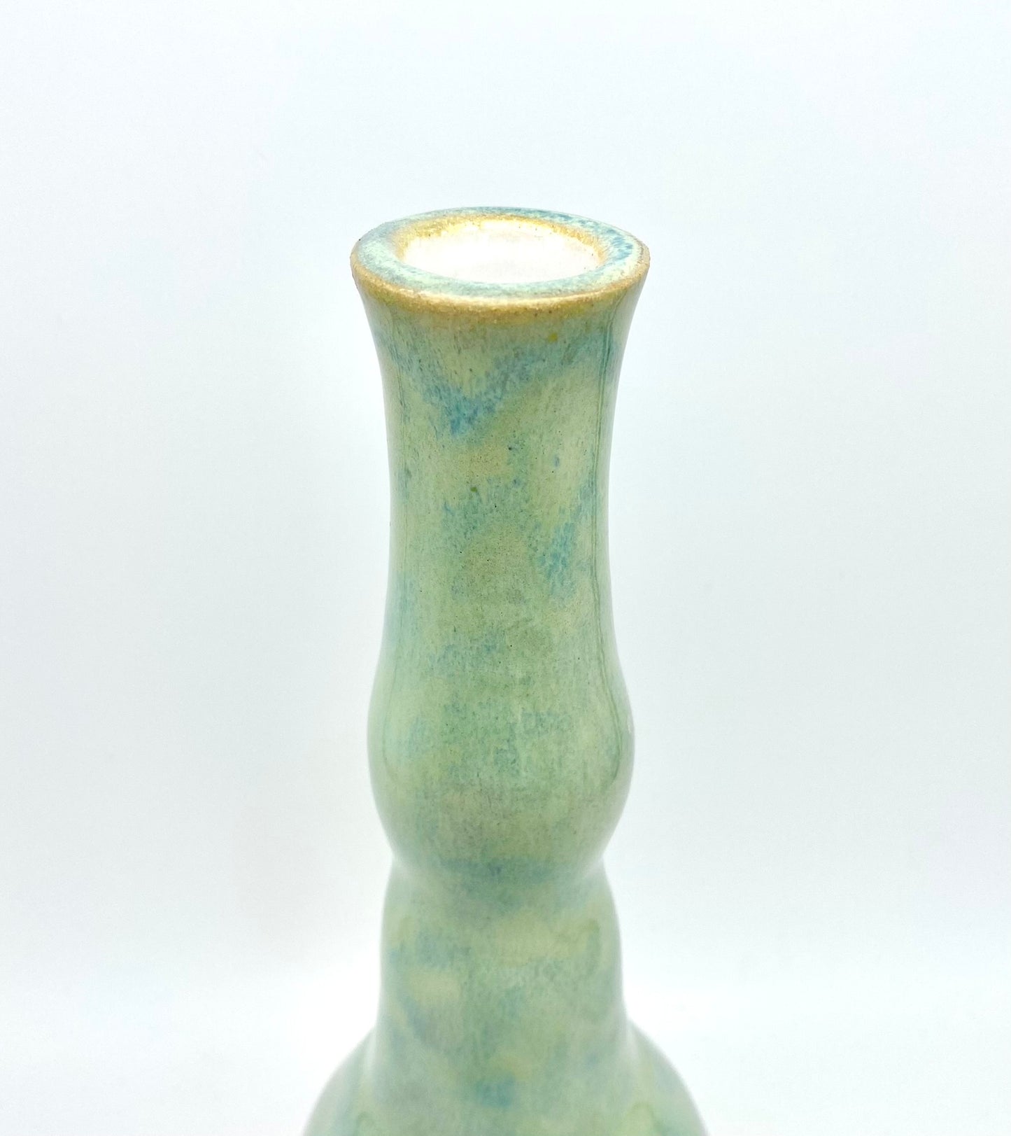 Tall candlestick or vase in flowing greens