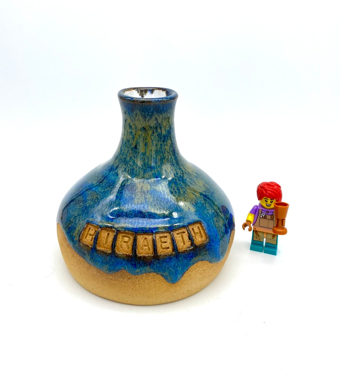 'Hiraeth' bud vase in rich blue glazes on toasty clay