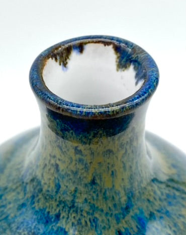 'Hiraeth' bud vase in rich blue glazes on toasty clay