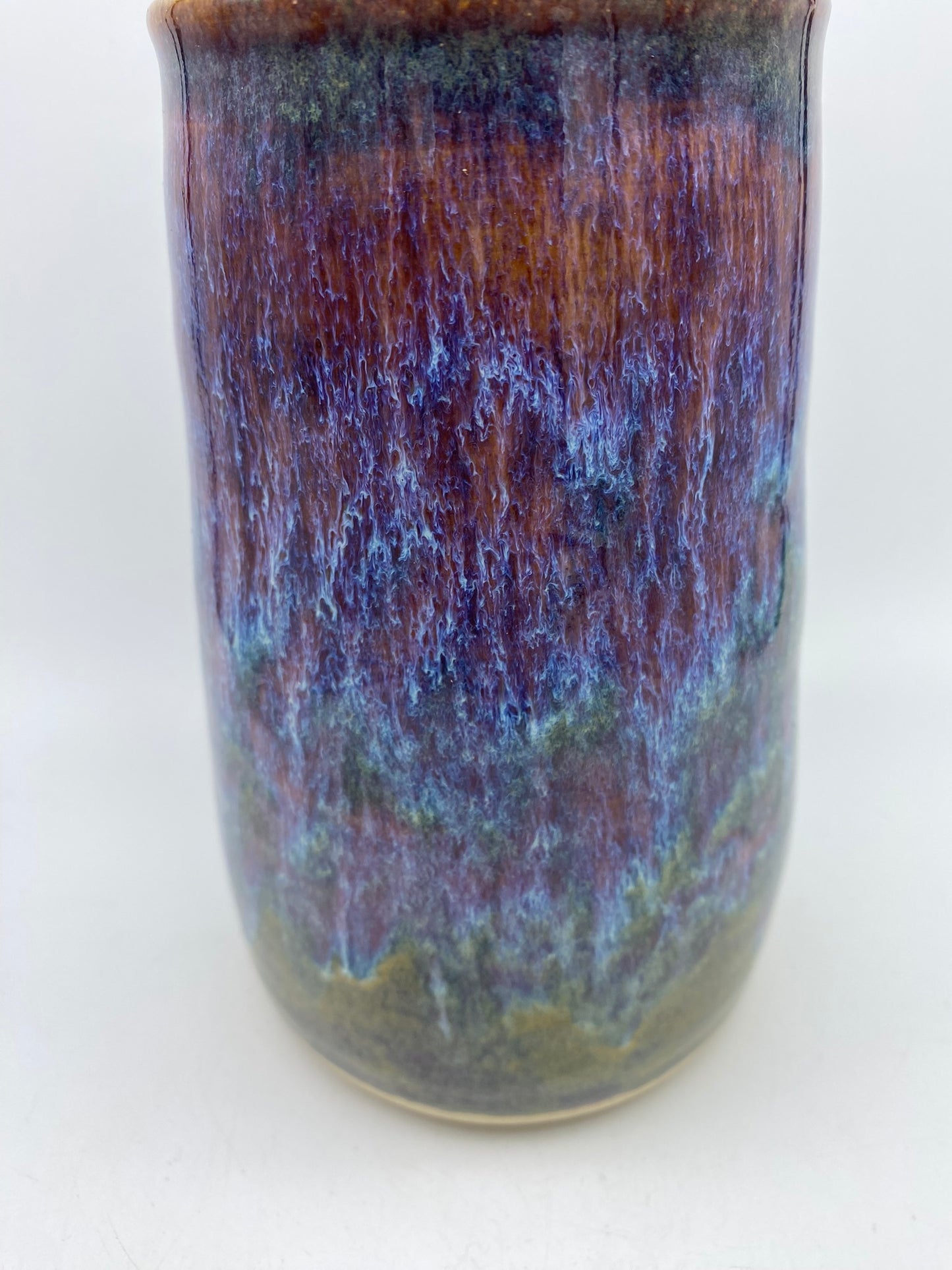 Tall lidded jar in heathery glazes