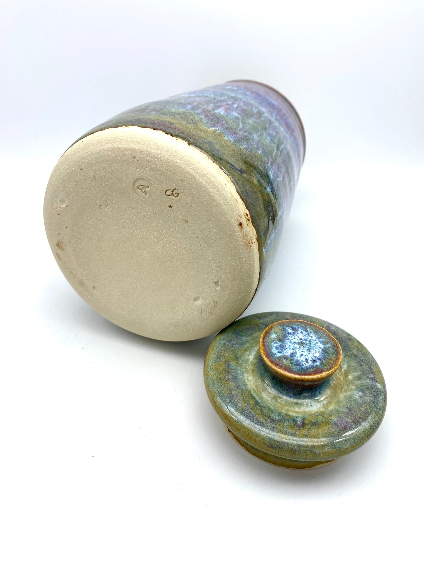 Tall lidded jar in heathery glazes