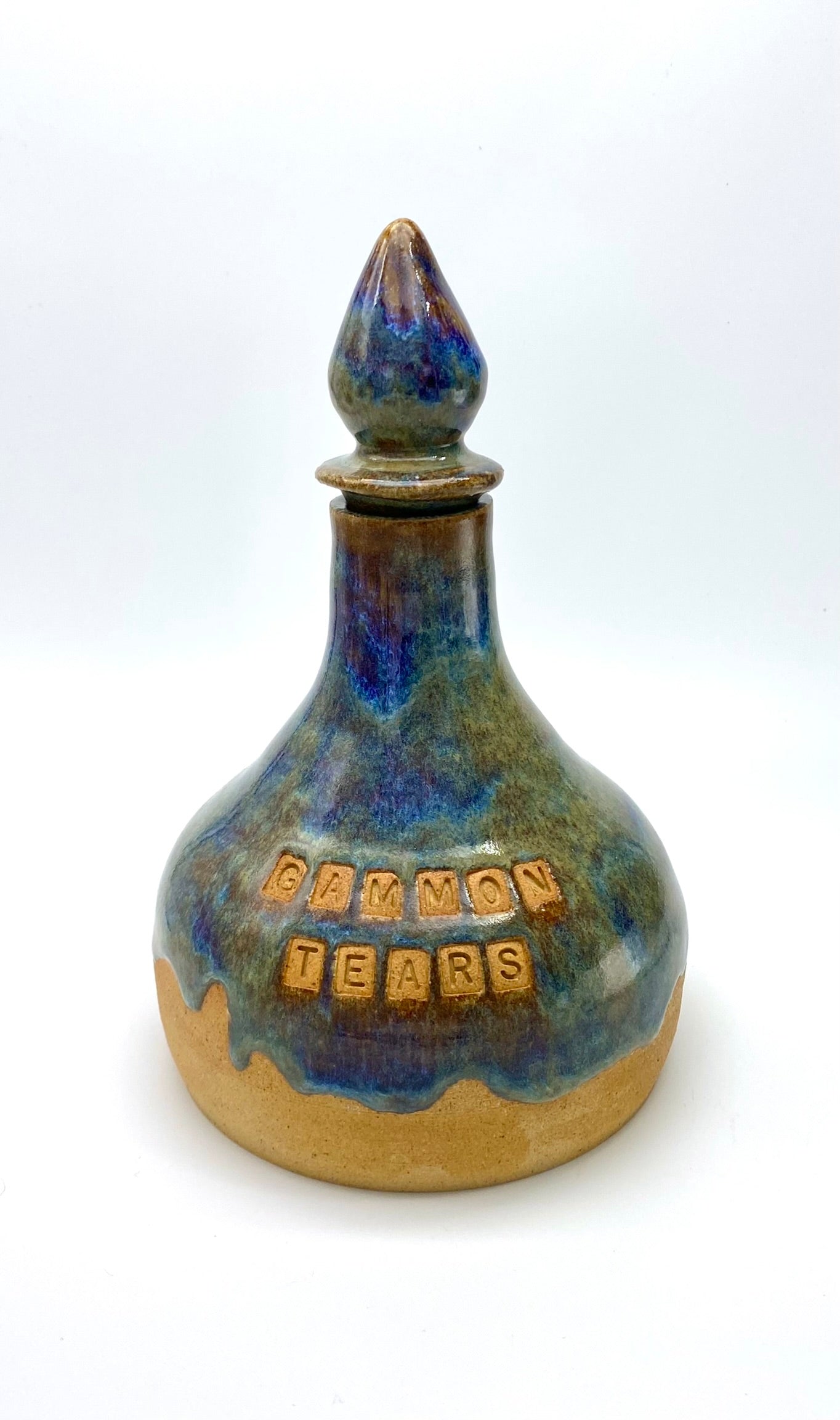 'Gammon Tears' decanter in blues and greens on lovely toasty clay