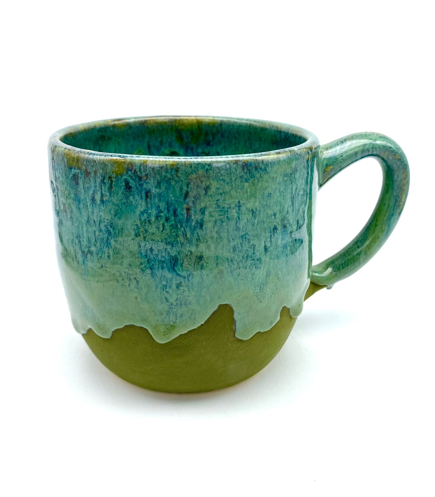 Mug in lush dripping greens