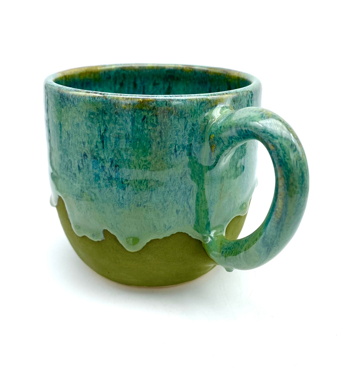 Mug in lush dripping greens