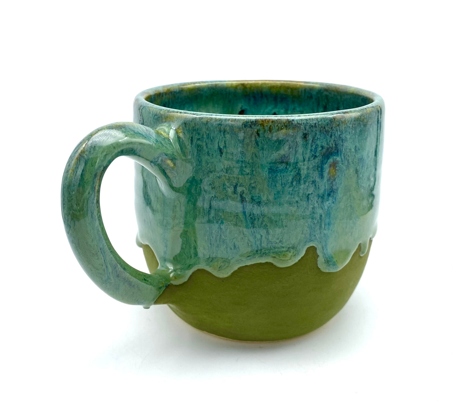 Mug in lush dripping greens