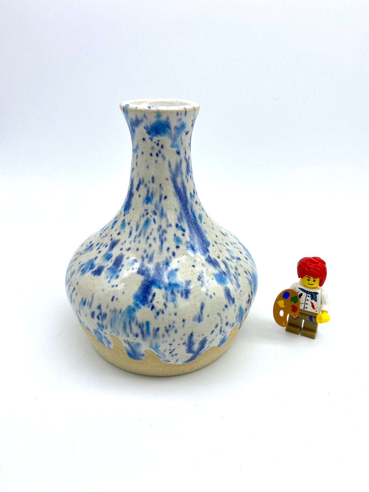 Bud vase in speckled blues on white