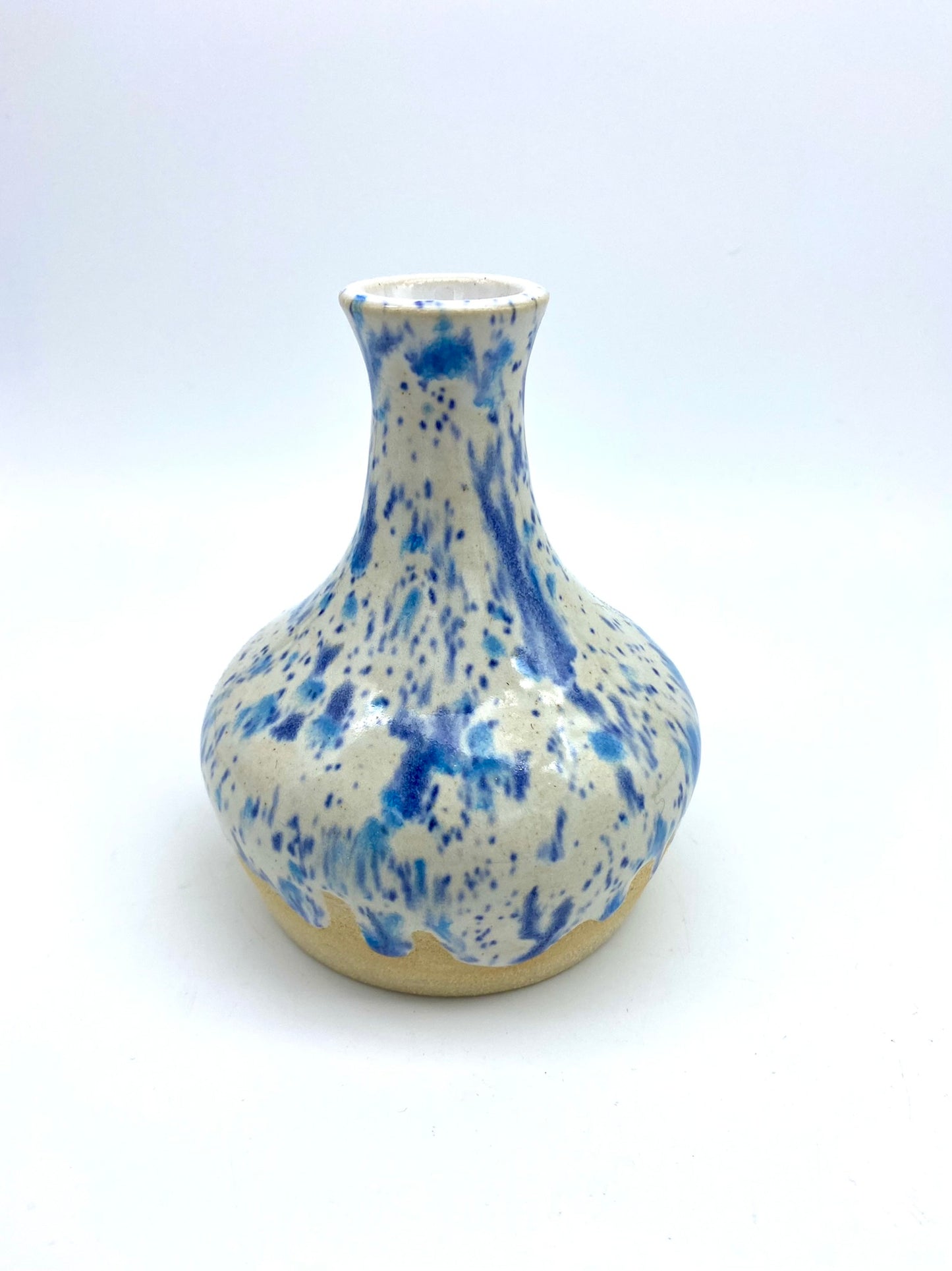 Bud vase in speckled blues on white