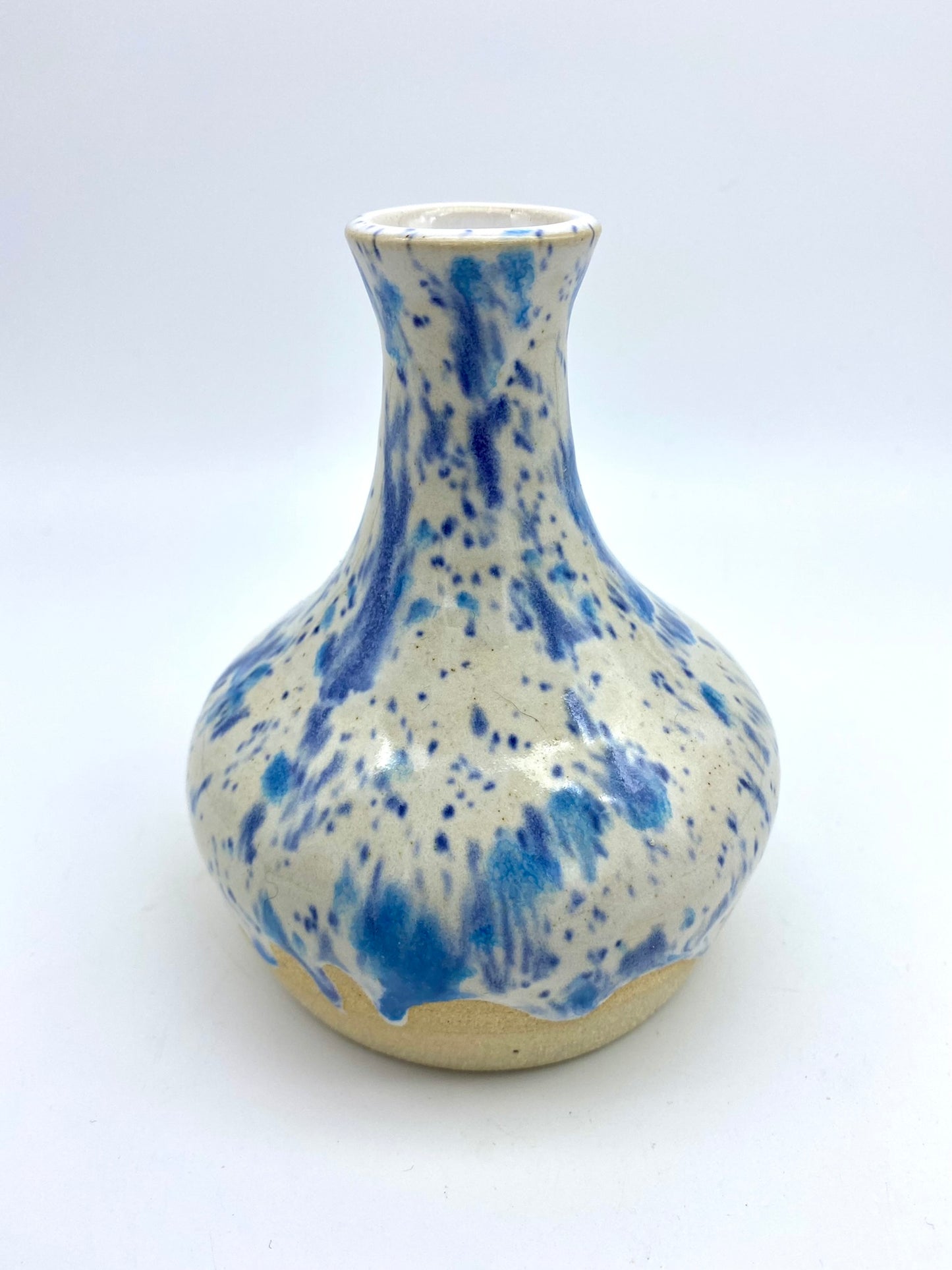 Bud vase in speckled blues on white