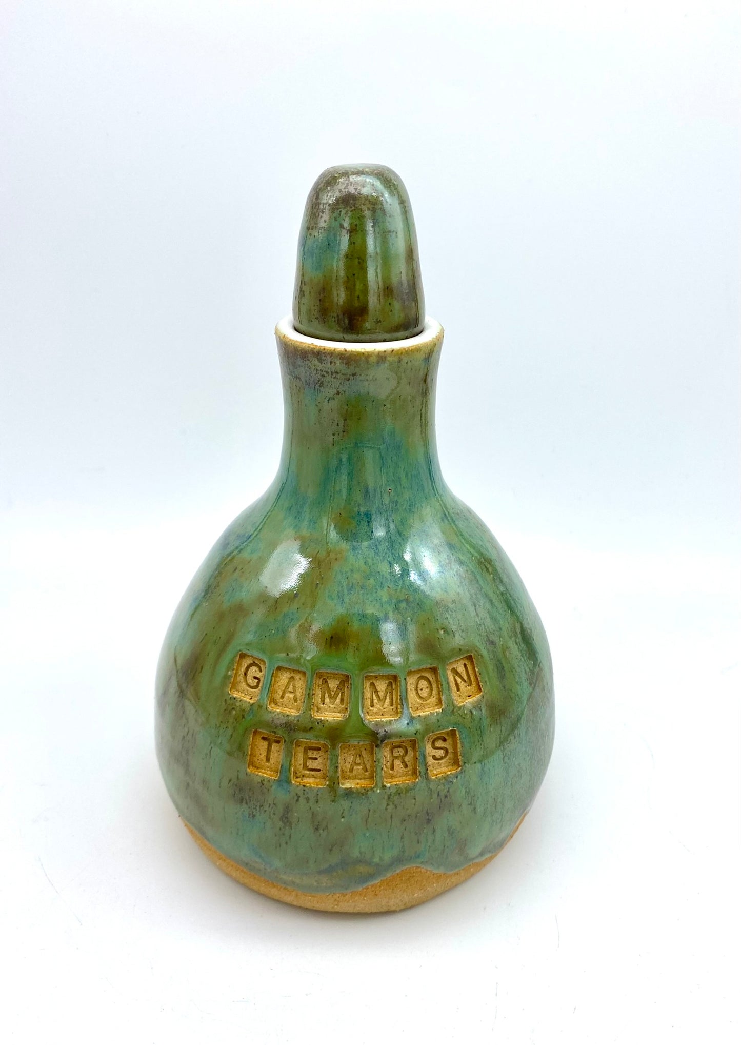 'Gammon tears' decanter in greeny blues on toasty clay