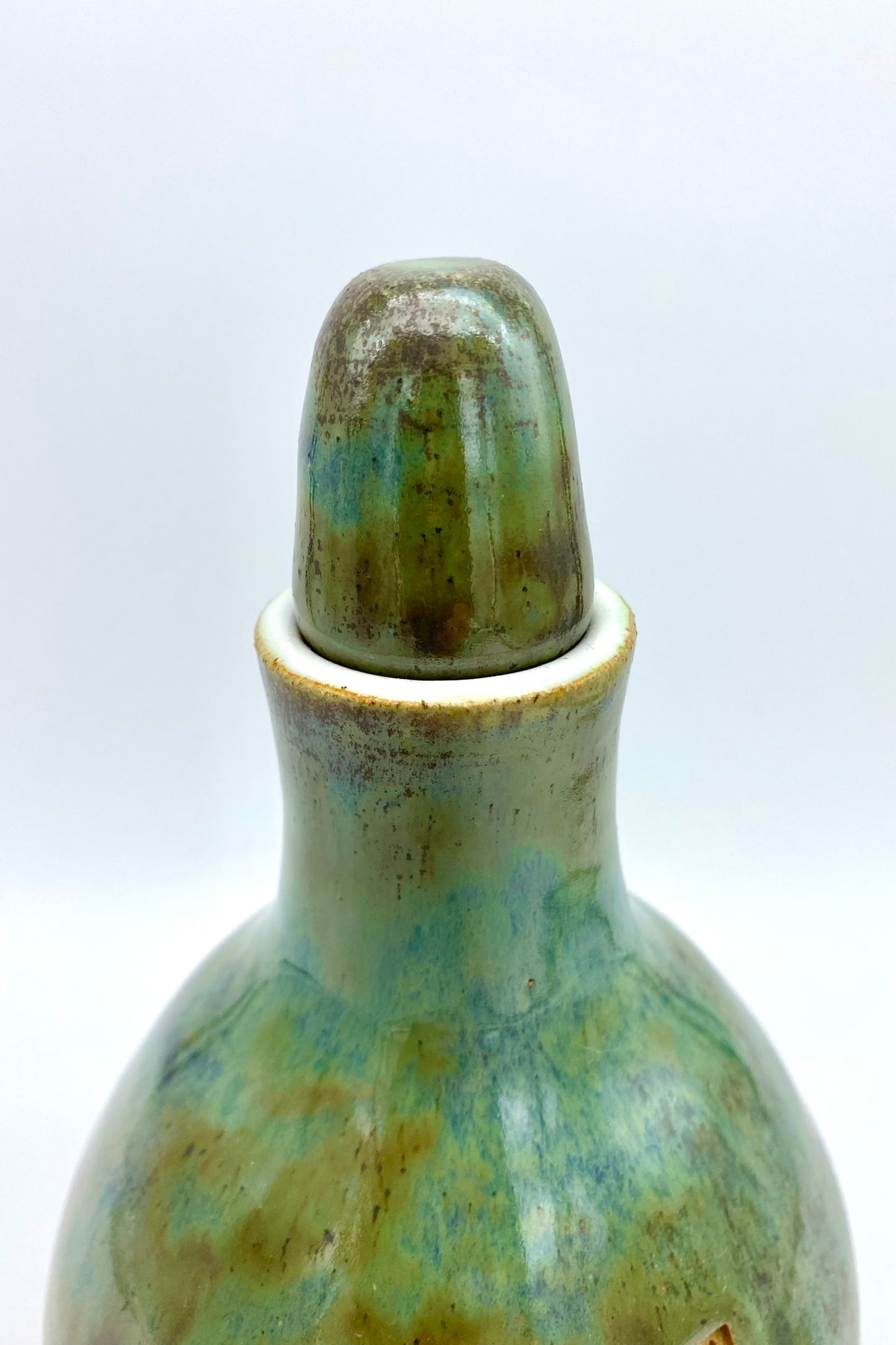 'Gammon tears' decanter in greeny blues on toasty clay