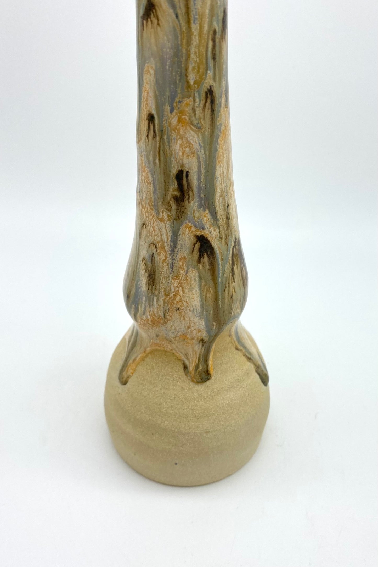 Tall candlestick in creams and browns