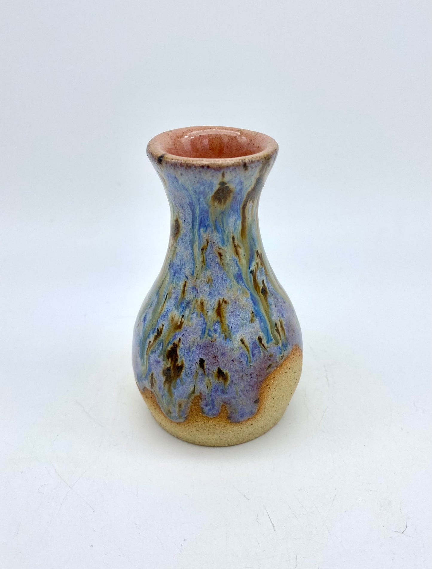 Just a stunning tiny vase in toasty clay