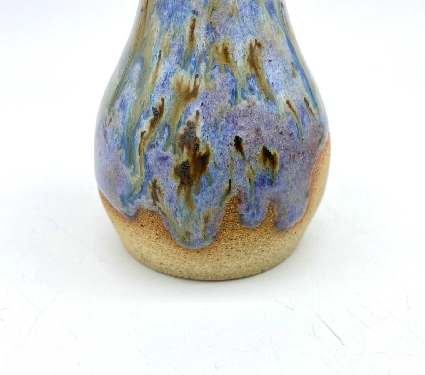 Just a stunning tiny vase in toasty clay