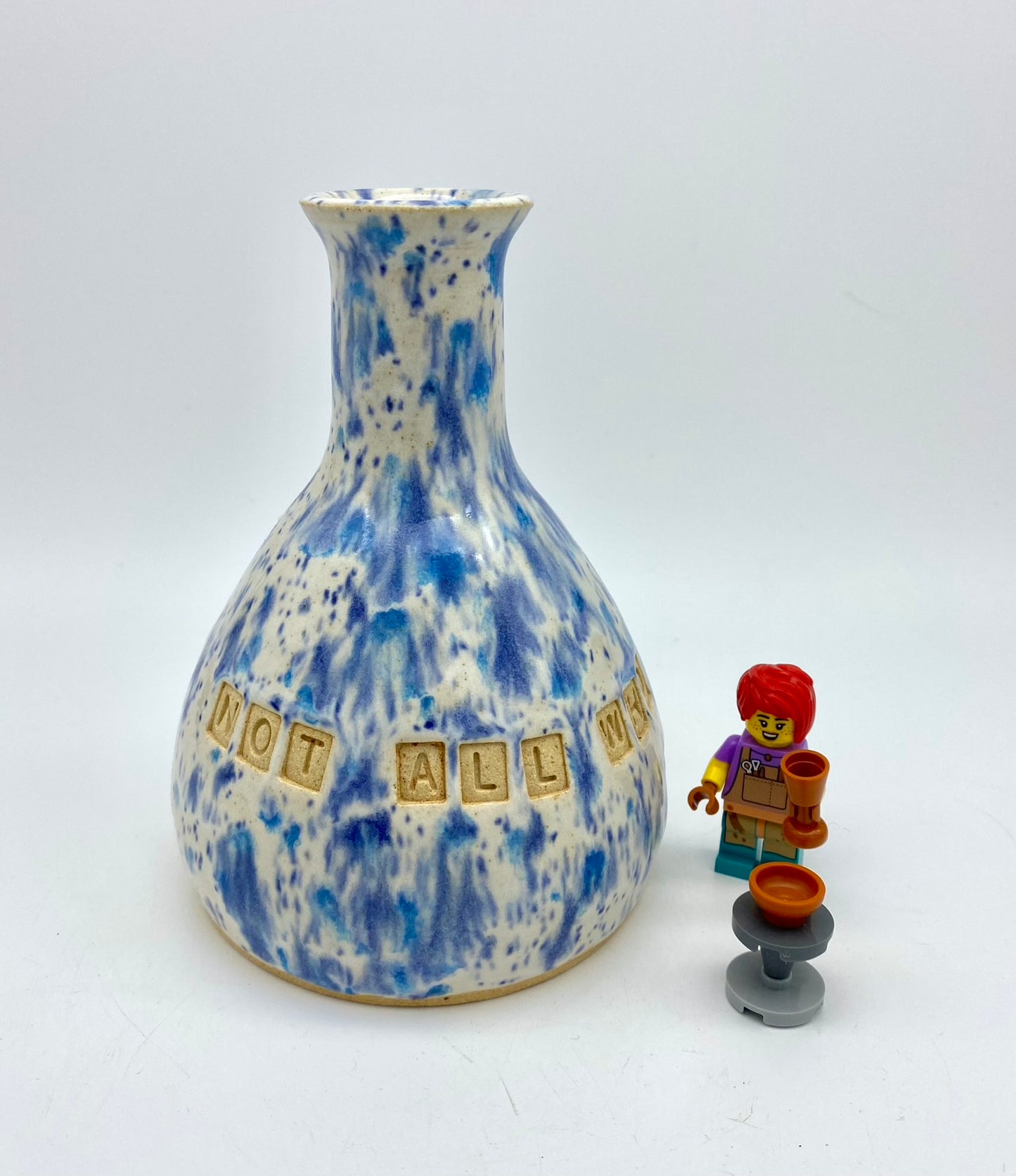 'Not all who wander are lost' bud vase in speckly blues