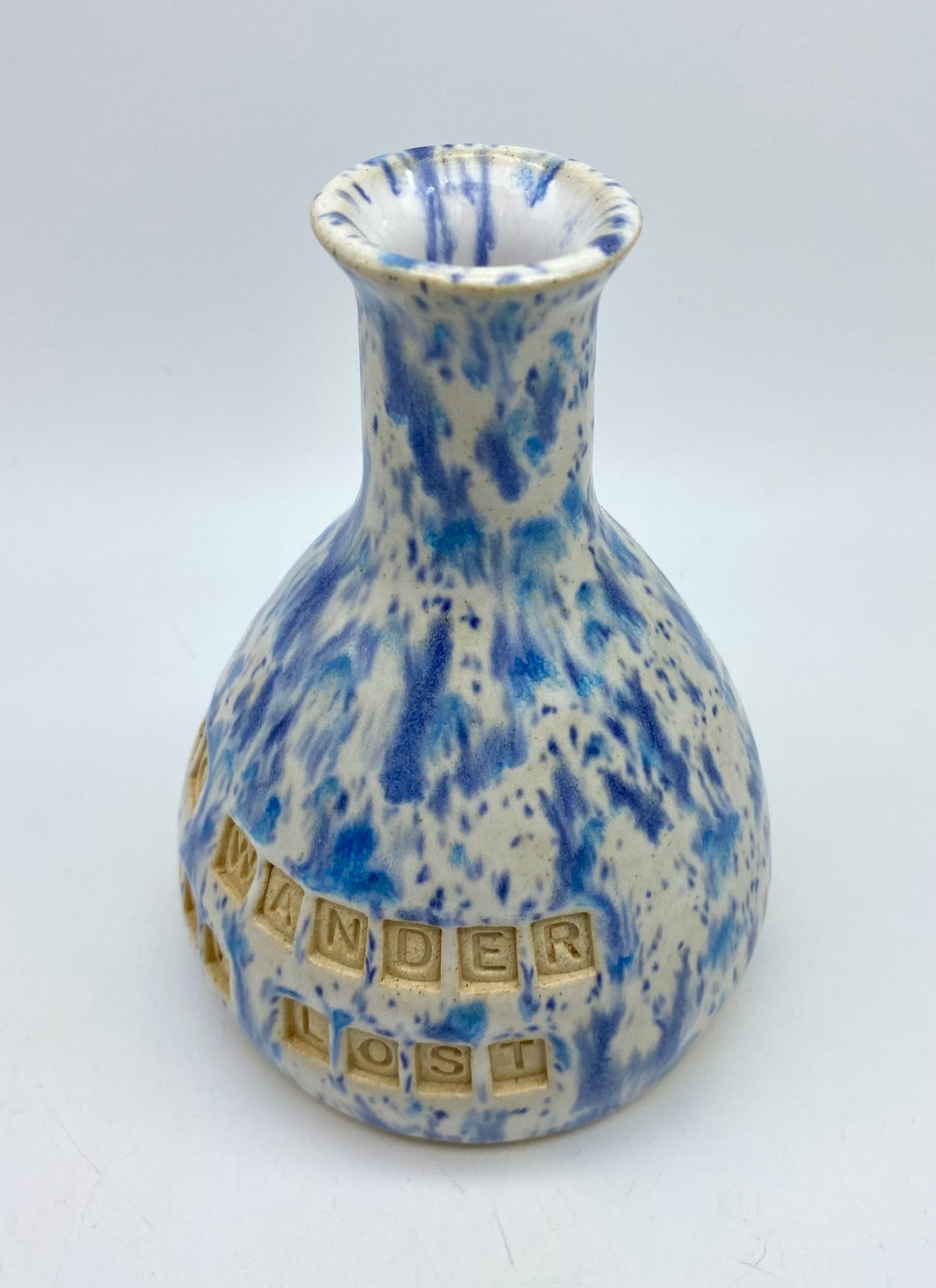 'Not all who wander are lost' bud vase in speckly blues